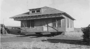 Bob Smith Farmhouse up on blocks, ready to be moved to location for parsonage