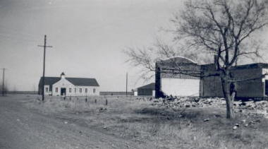 In this March 1959 photograph, the Church stands in silent witness to the final stages in the demolition of the old school.