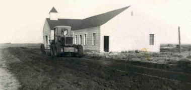 1952, Joe Denham ran the road grader over the church grounds .